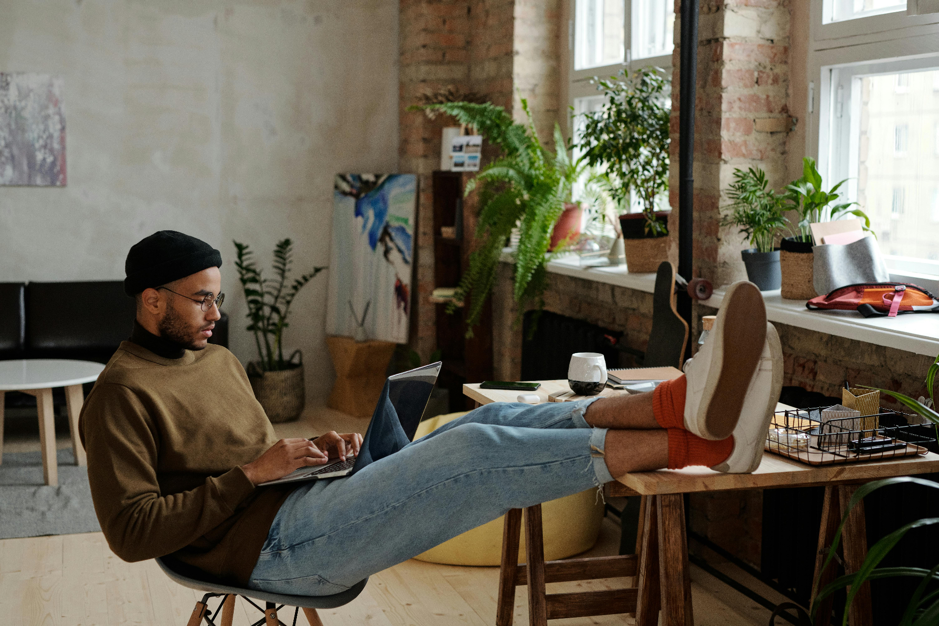 Remote worker relaxing with a laptop