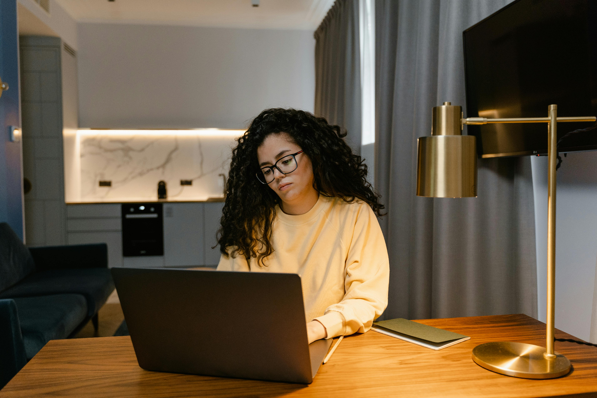 Woman working on laptop at her desk